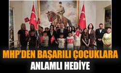 MHP’den başarılı çocuklara anlamlı hediye